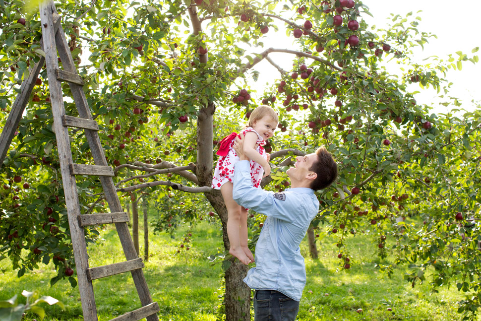 Family picture in an apple orchard.