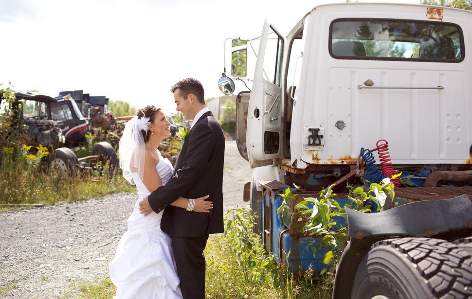 Wedding photo shoot in a scrap yard.